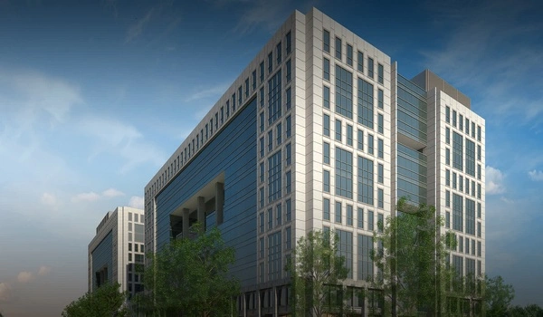 Sleek glass-fronted commercial office building of Sattva Knowledge Point